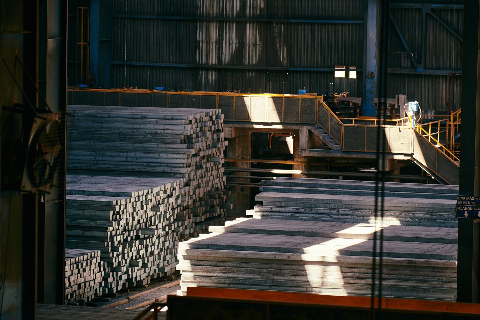 Steel stock stacked in an industrial warehouse