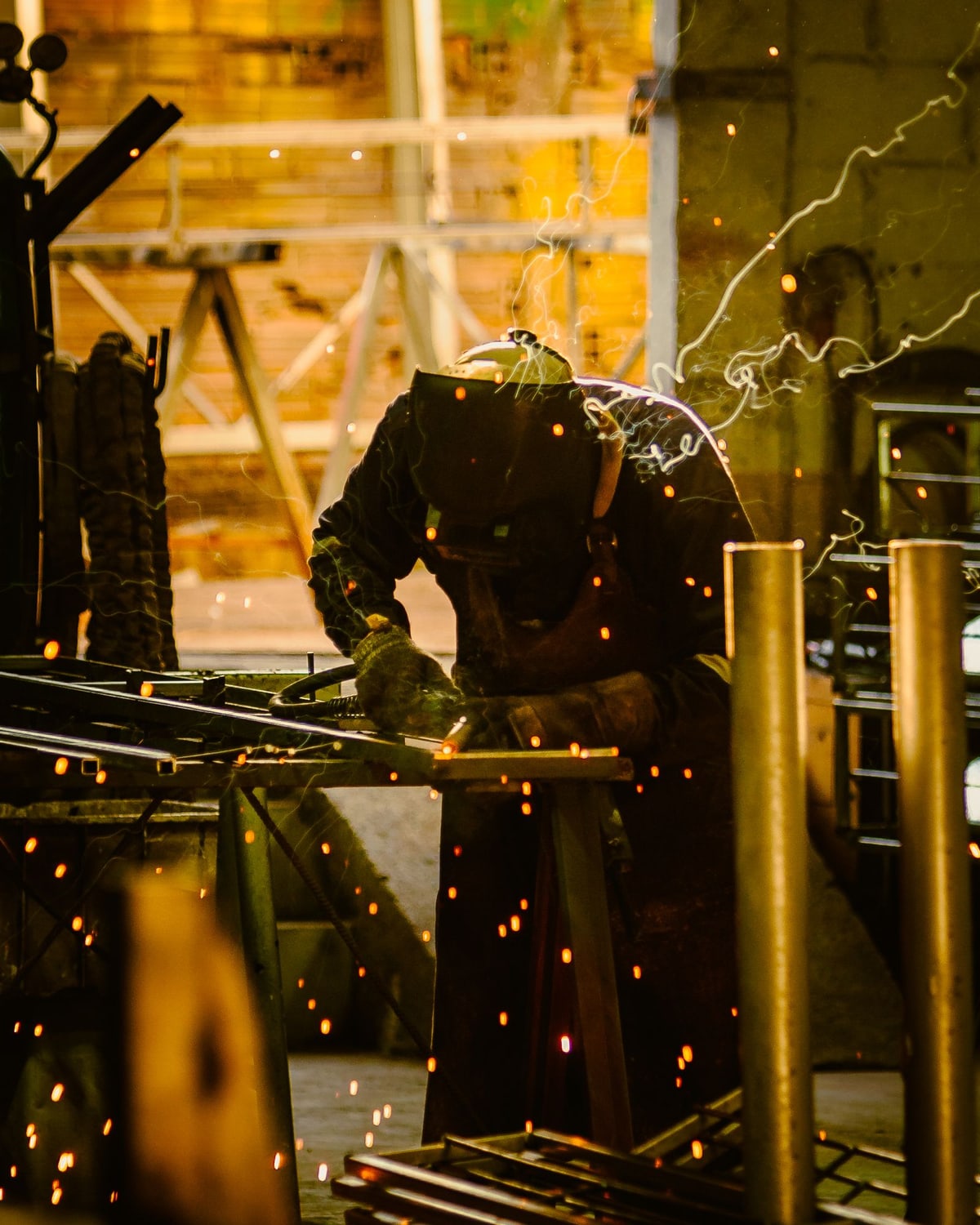 Steel components being welded together in a workshop